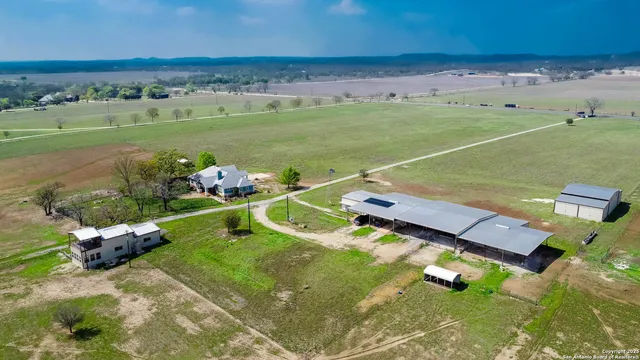 an aerial view of a golf course with chairs