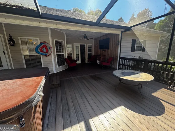 a view of a balcony with table and chairs
