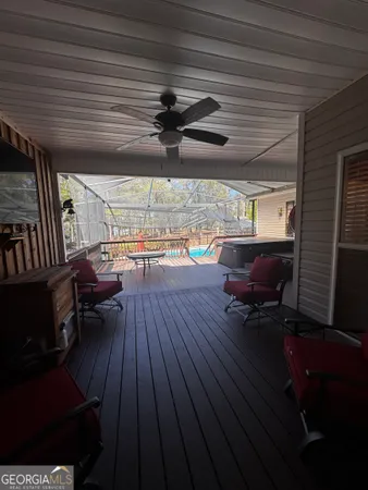 a living room with a table chairs and a wooden roof