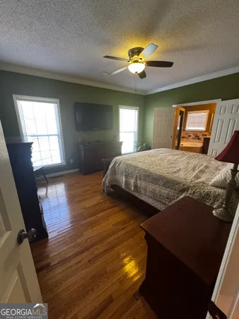 a bedroom with bed and window