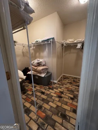 a couple of table and chairs in a room