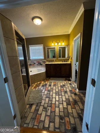 a bathroom with a bathtub and shower