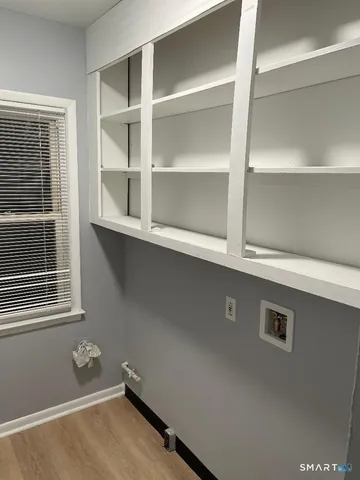 a view of an empty room with a cabinet