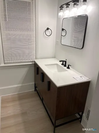 a utility room with a sink washer and dryer