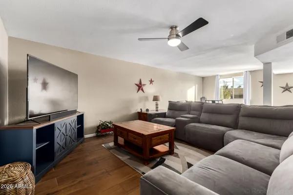 a living room with furniture and a flat screen tv