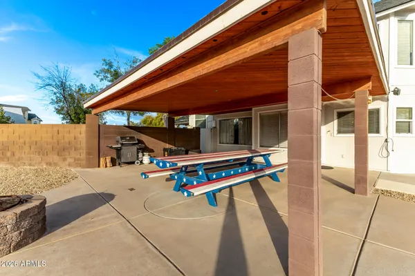 a view of backyard with a patio