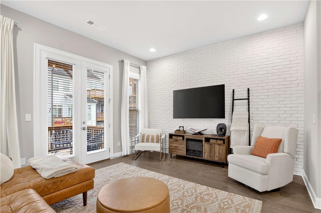 4302 Parkside Place Atlanta, GA 30342 - Photo 12 of 33 a living room with furniture and a flat screen tv
