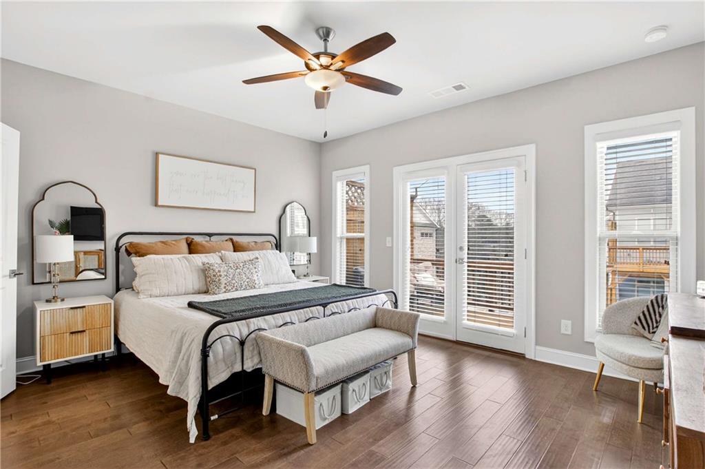 4302 Parkside Place Atlanta, GA 30342 - Photo 19 of 33 a bedroom with a large bed and a large window