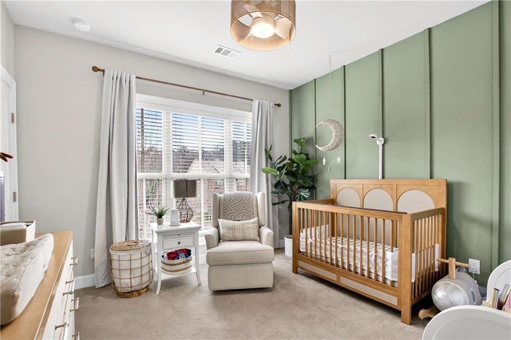 4302 Parkside Place Atlanta, GA 30342 - Photo 23 of 33 a bedroom with furniture and a large window
