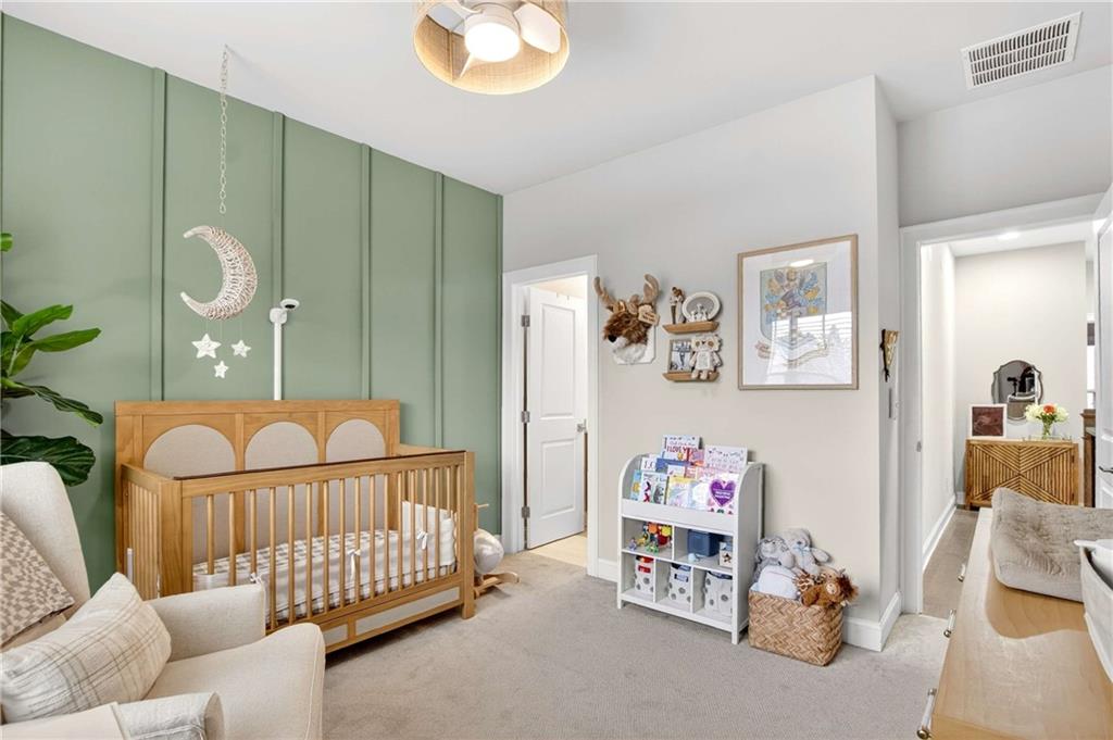 4302 Parkside Place Atlanta, GA 30342 - Photo 24 of 33 a bedroom with furniture and a window