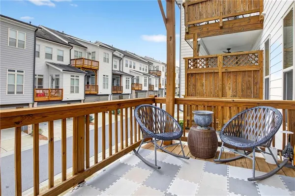 a view of a balcony with furniture