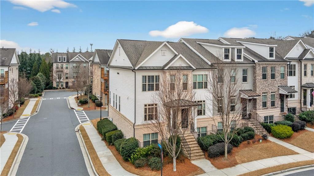 4302 Parkside Place Atlanta, GA 30342 - Photo 31 of 33 a front view of a house with a yard
