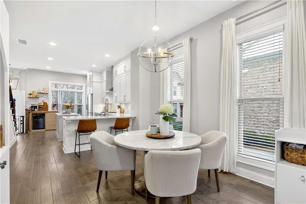 a view of a dining room with furniture window and wooden floor