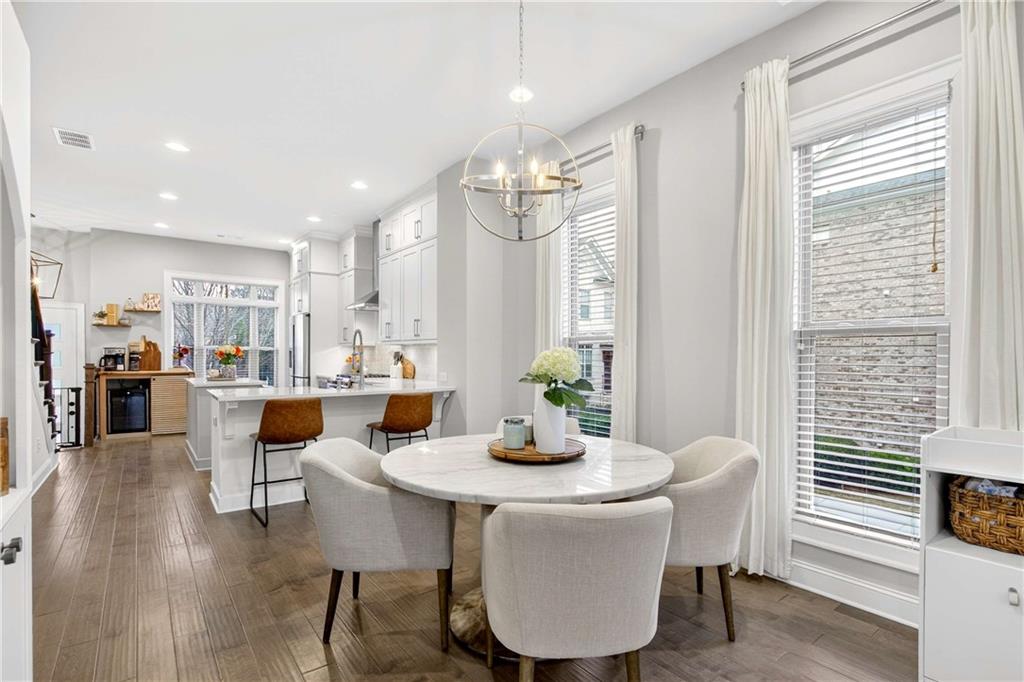 4302 Parkside Place Atlanta, GA 30342 - Photo 10 of 33 a view of a dining room with furniture window and wooden floor