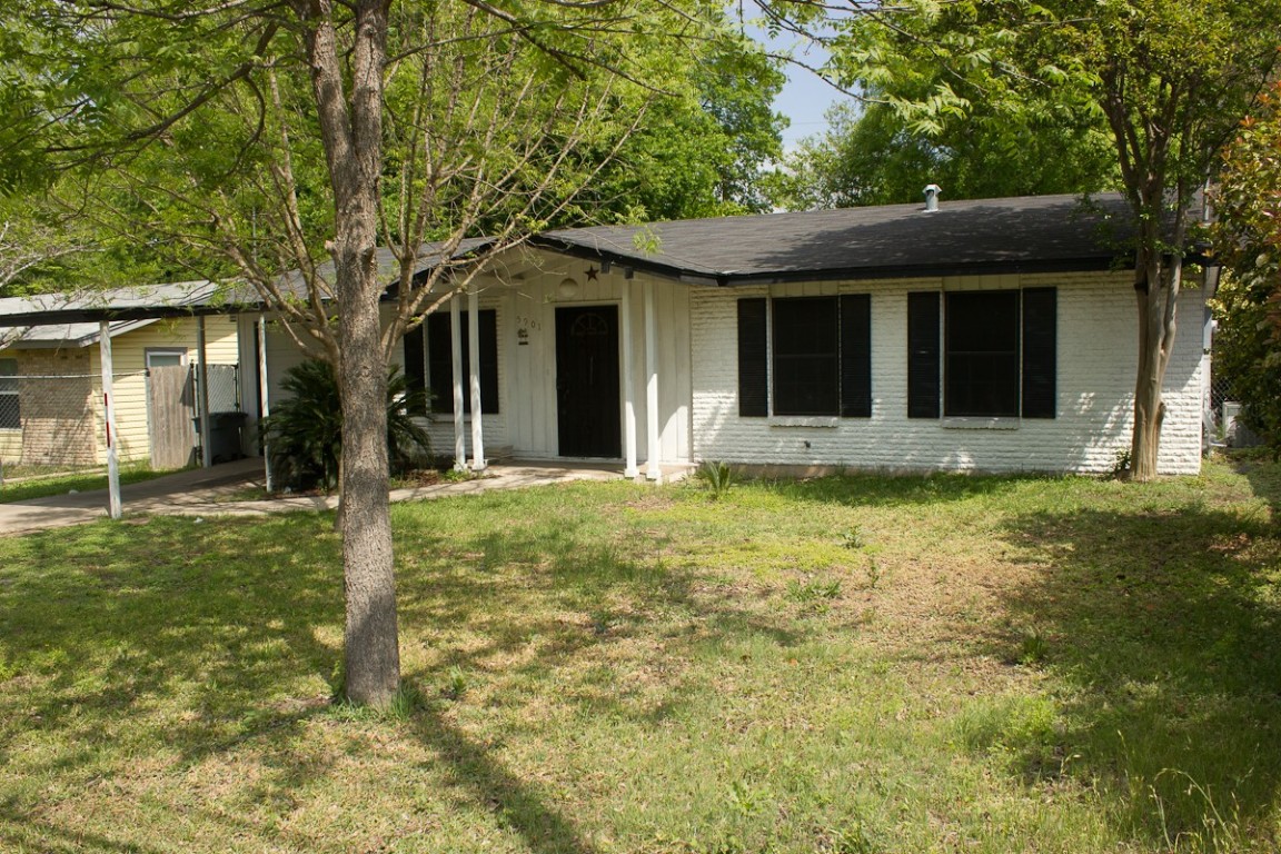 5901 South 1st Street Austin, TX 78745 - Photo 1 of 19 front view of a house with a yard