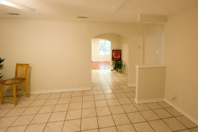 a view of a livingroom and entryway