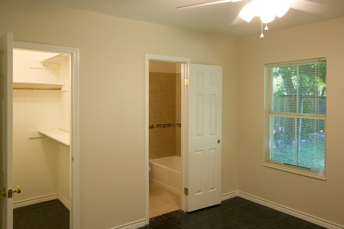 5901 South 1st Street Austin, TX 78745 - Photo 10 of 19 an empty room with windows and closet
