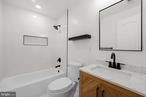 a view of a hallway with washer and dryer