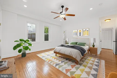 a spacious bedroom with a bed and furniture