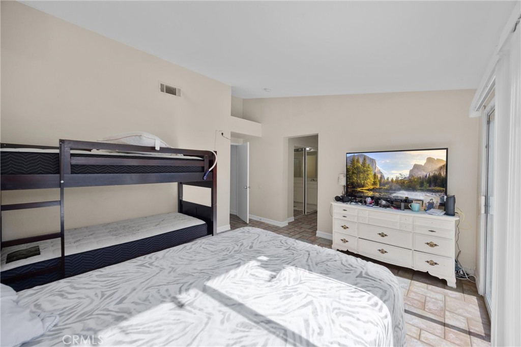 711 Myrtle Avenue Perris, CA 92571 - Photo 11 of 28 a bedroom with a bed and dresser