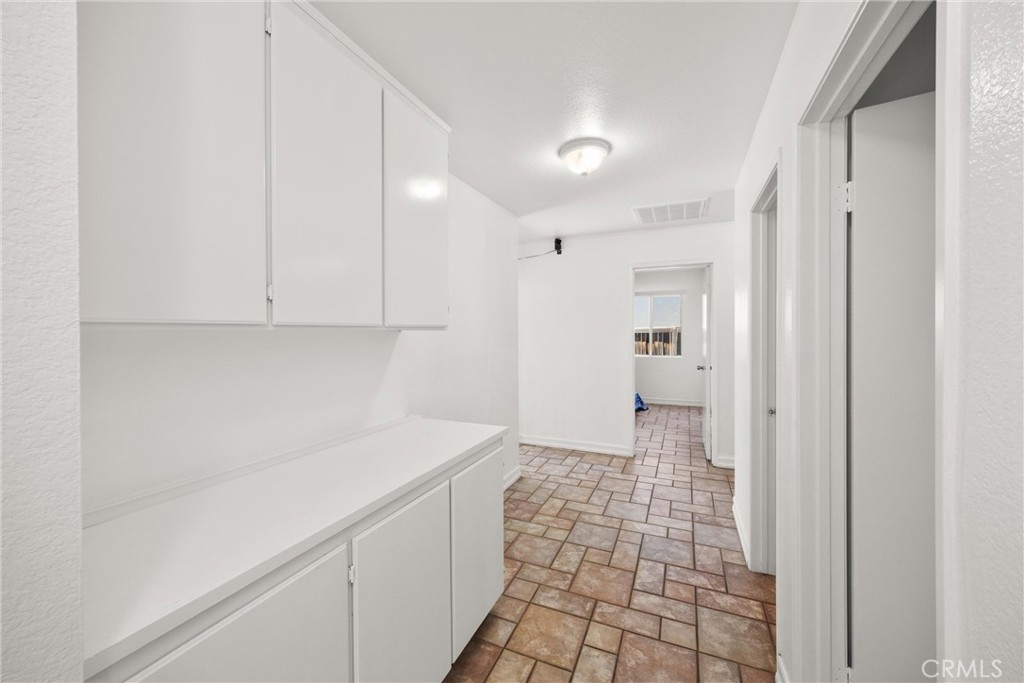 711 Myrtle Avenue Perris, CA 92571 - Photo 13 of 28 a bathroom with a sink and a mirror