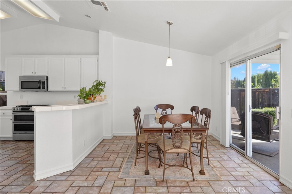 711 Myrtle Avenue Perris, CA 92571 - Photo 17 of 28 a view of a dining room with furniture window and outside view