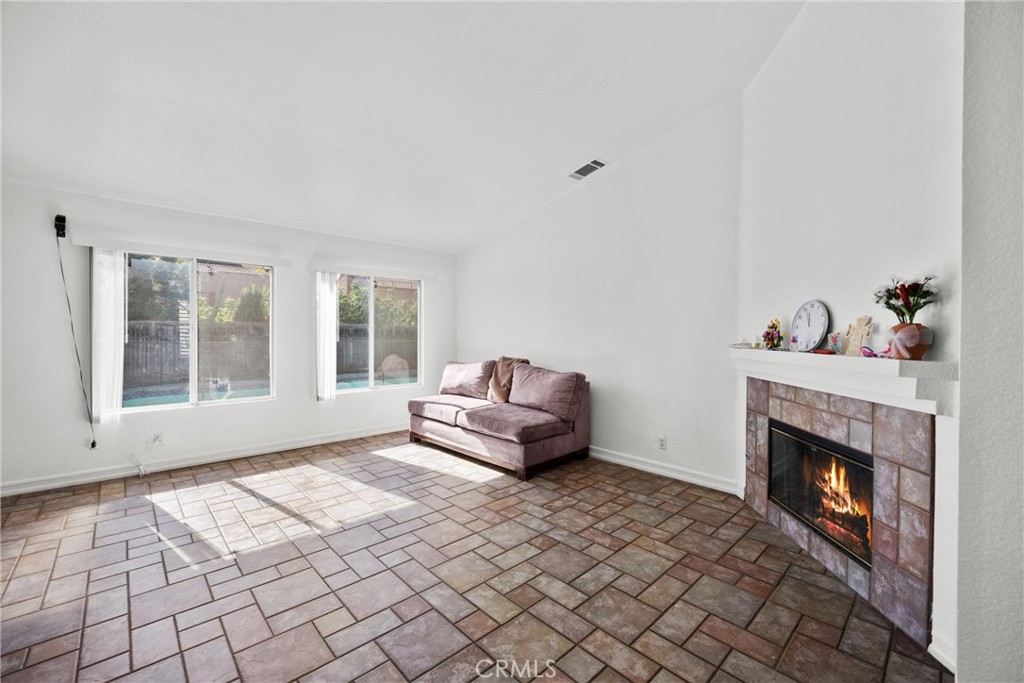711 Myrtle Avenue Perris, CA 92571 - Photo 20 of 28 a living room with furniture and a fireplace