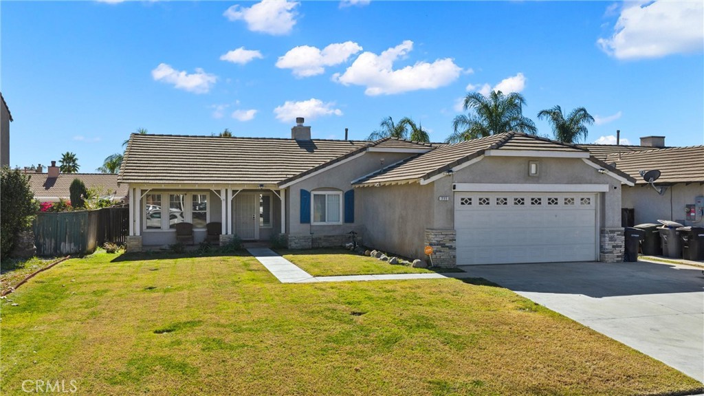 711 Myrtle Avenue Perris, CA 92571 - Photo 27 of 28 a front view of a house with swimming pool