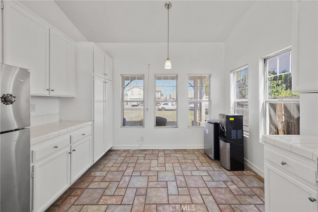 711 Myrtle Avenue Perris, CA 92571 - Photo 6 of 28 a view of a kitchen with refrigerator and window