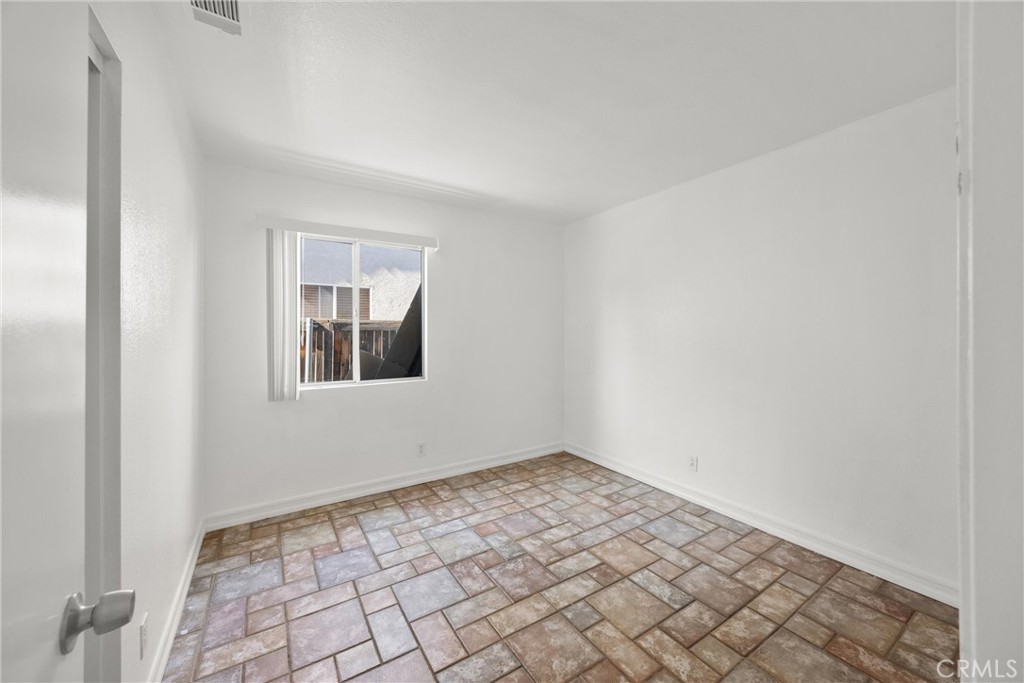 711 Myrtle Avenue Perris, CA 92571 - Photo 10 of 28 a view of an empty room with window