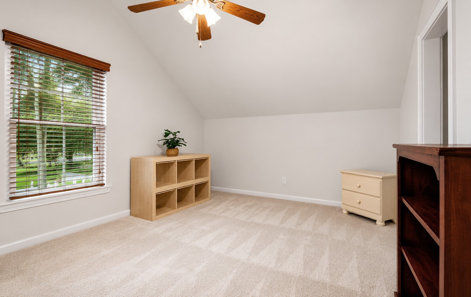 312 Springwood Drive Conroe, TX 77385 - Photo 36 of 50 The second upstairs bedroom is expansive and bright.