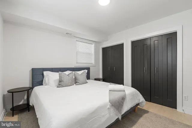 a bedroom with a bed and a closet