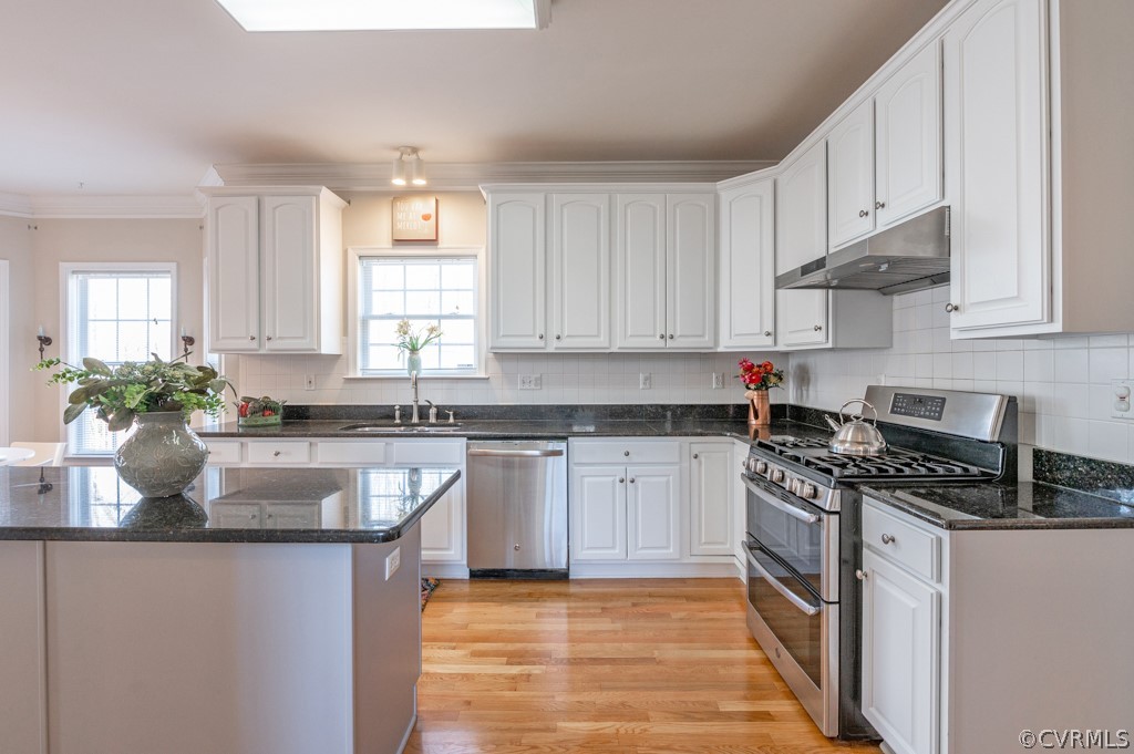 1313 Goswick Ridge Road Midlothian, VA 23114 - Photo 12 of 31 a kitchen with stainless steel appliances granite countertop a sink stove and cabinets