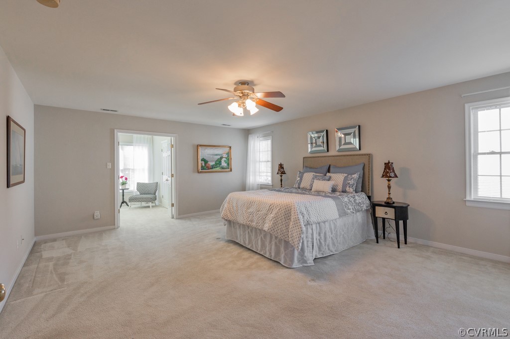 1313 Goswick Ridge Road Midlothian, VA 23114 - Photo 18 of 31 a spacious bedroom with a bed and a chandelier