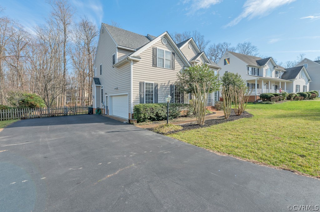 1313 Goswick Ridge Road Midlothian, VA 23114 - Photo 2 of 31 a front view of a house with a yard and trees