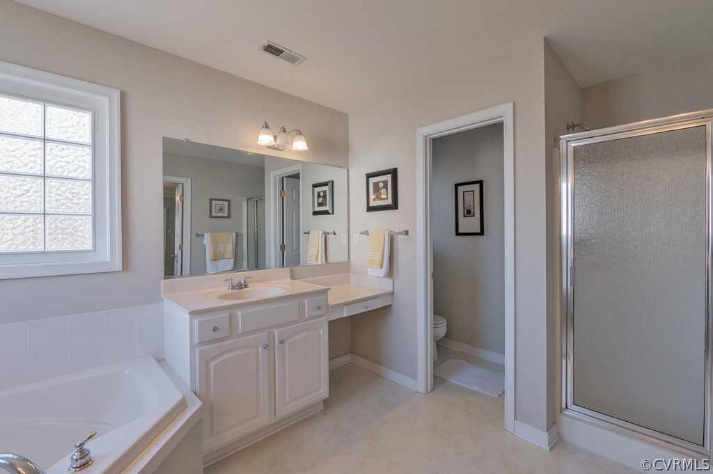1313 Goswick Ridge Road Midlothian, VA 23114 - Photo 22 of 31 a spacious bathroom with a tub sink and mirror