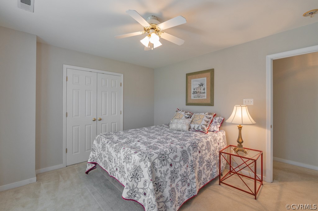 1313 Goswick Ridge Road Midlothian, VA 23114 - Photo 23 of 31 a bedroom with a bed and a chandelier