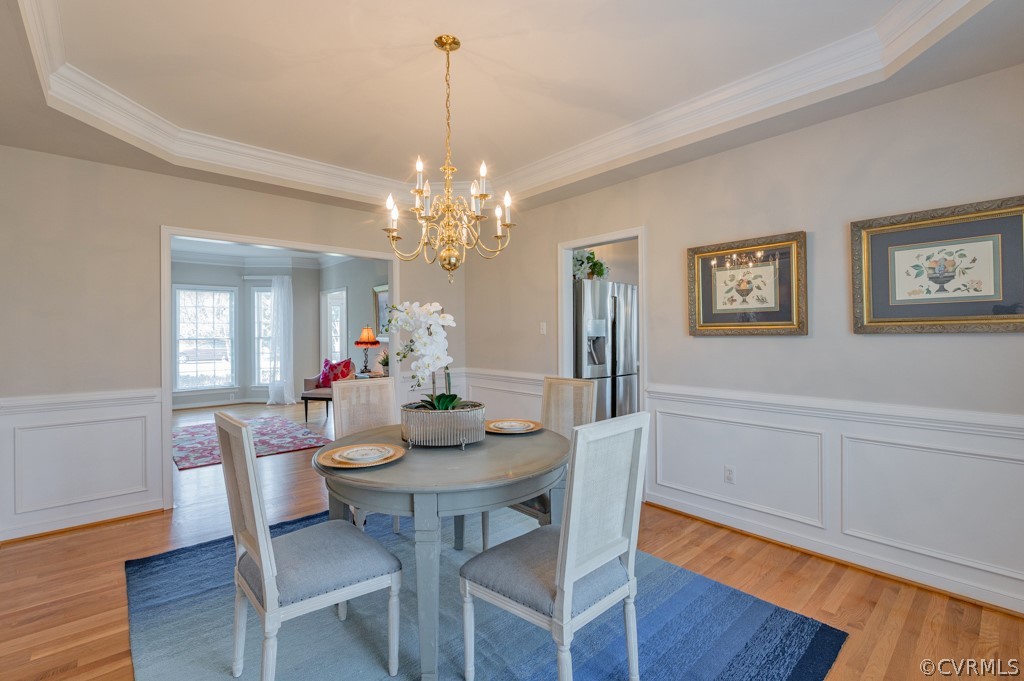 1313 Goswick Ridge Road Midlothian, VA 23114 - Photo 8 of 31 a view of a dining room with furniture and wooden floor