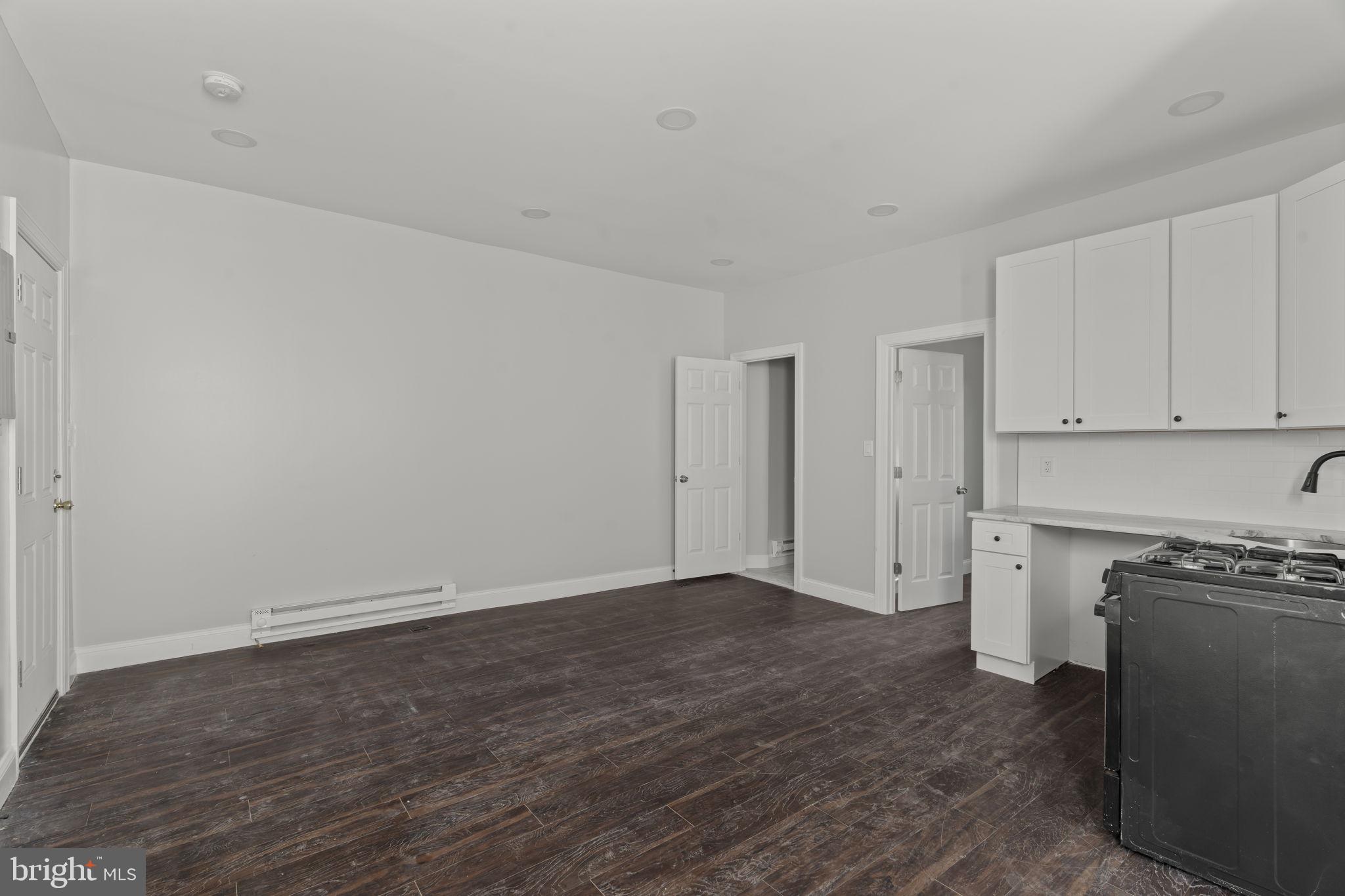 5237 Chester Avenue Philadelphia, PA 19143 - Photo 22 of 41 a view of a kitchen with wooden floor