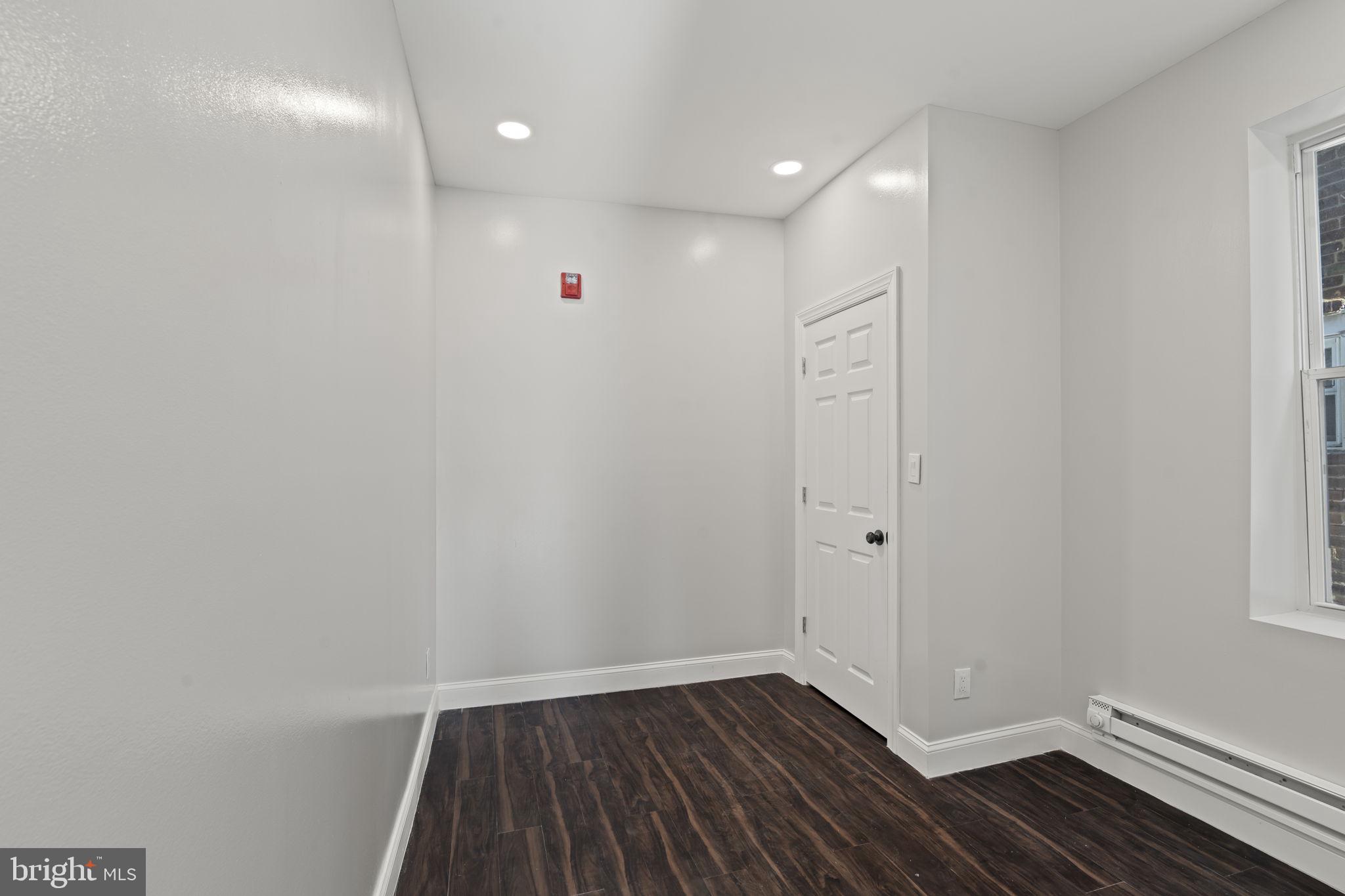 5237 Chester Avenue Philadelphia, PA 19143 - Photo 28 of 41 a view of an empty room with wooden floor