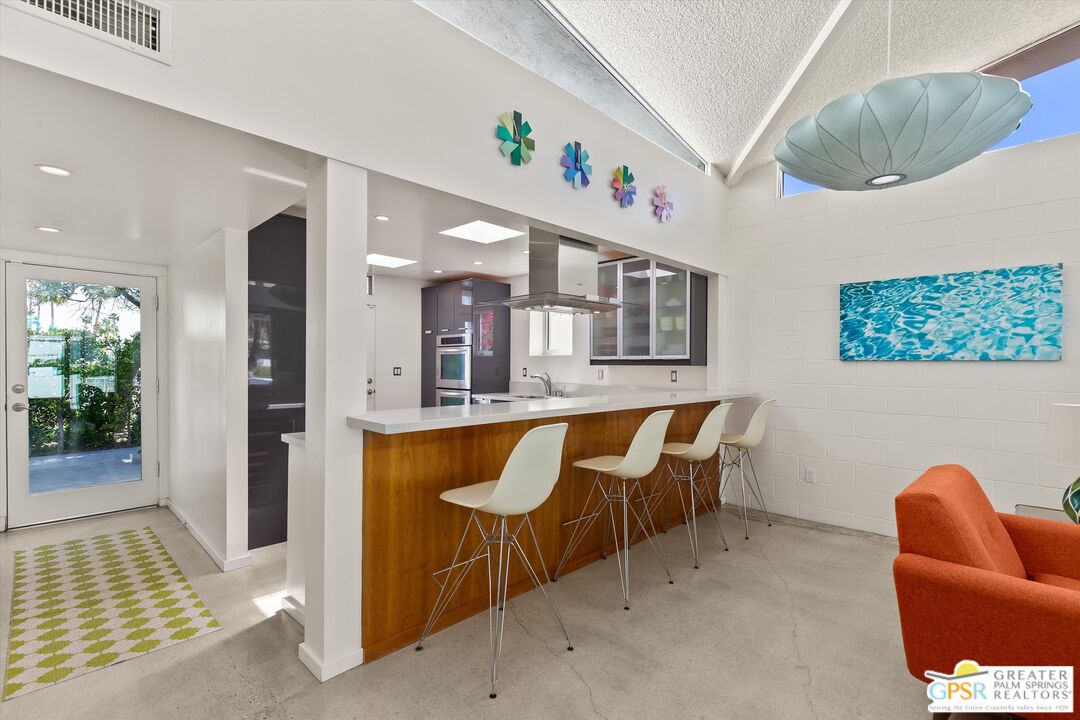 233 Toro Circle Palm Springs, CA 92264 - Photo 17 of 39 a dining room with furniture and window