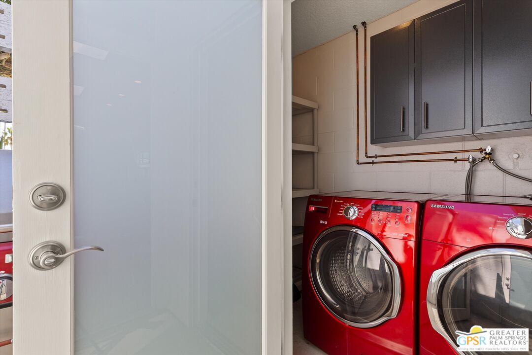 233 Toro Circle Palm Springs, CA 92264 - Photo 23 of 39 a utility room with dryer and washer