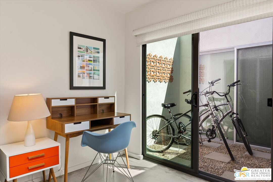233 Toro Circle Palm Springs, CA 92264 - Photo 33 of 39 a living room with furniture and a window
