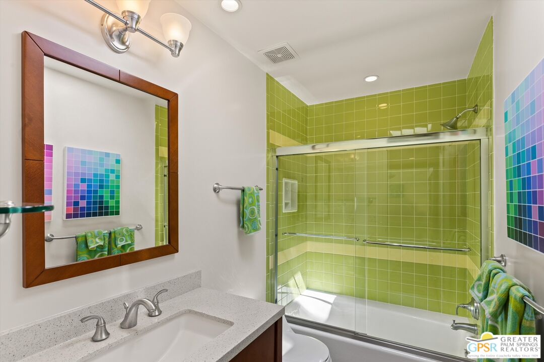 233 Toro Circle Palm Springs, CA 92264 - Photo 34 of 39 a bathroom with a sink and a mirror