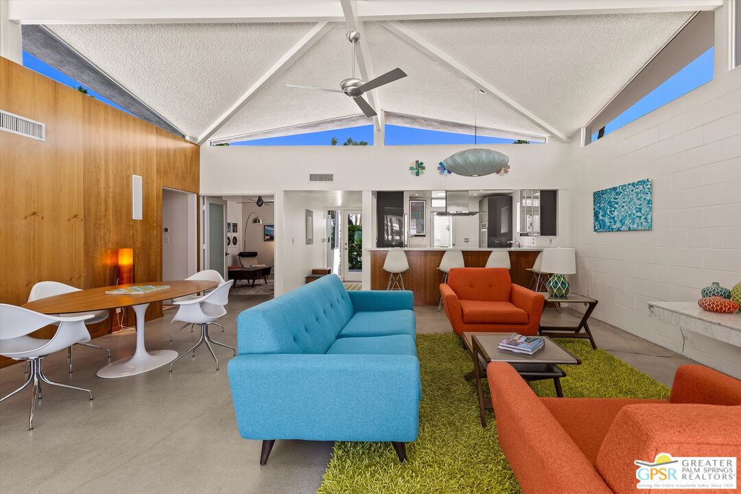 233 Toro Circle Palm Springs, CA 92264 - Photo 6 of 39 a living room with furniture a table and chairs