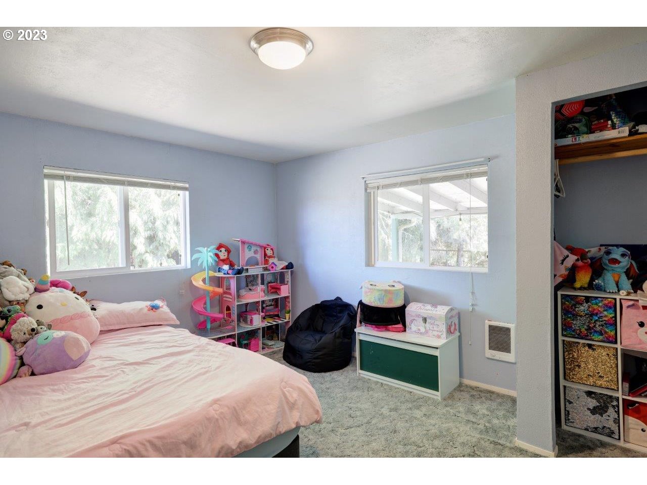6314 Sandridge Road Long Beach, WA 98631 - Photo 11 of 24 a bedroom with a bed a dresser and a book shelf