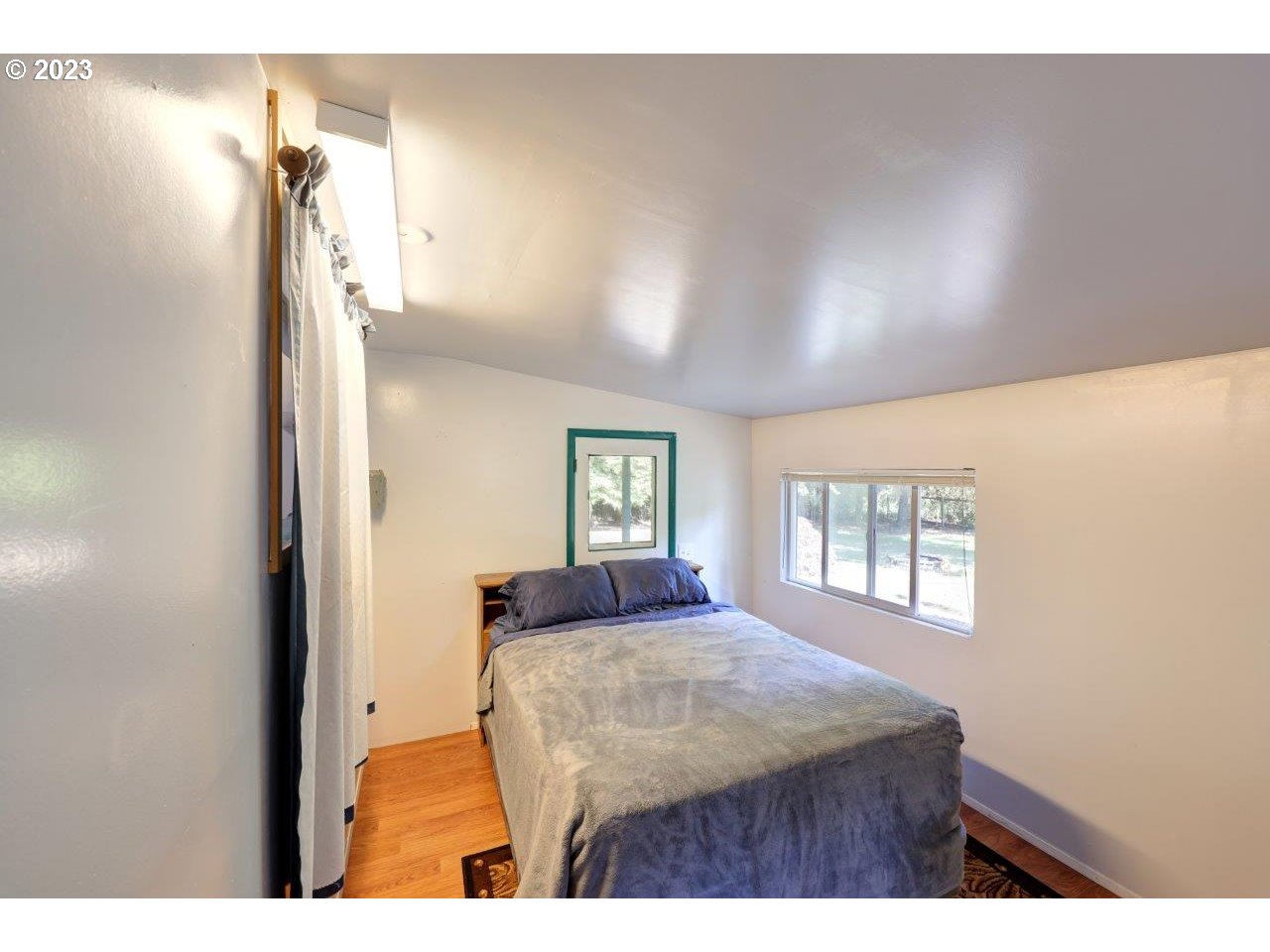 6314 Sandridge Road Long Beach, WA 98631 - Photo 14 of 24 a bedroom with a bed and a window