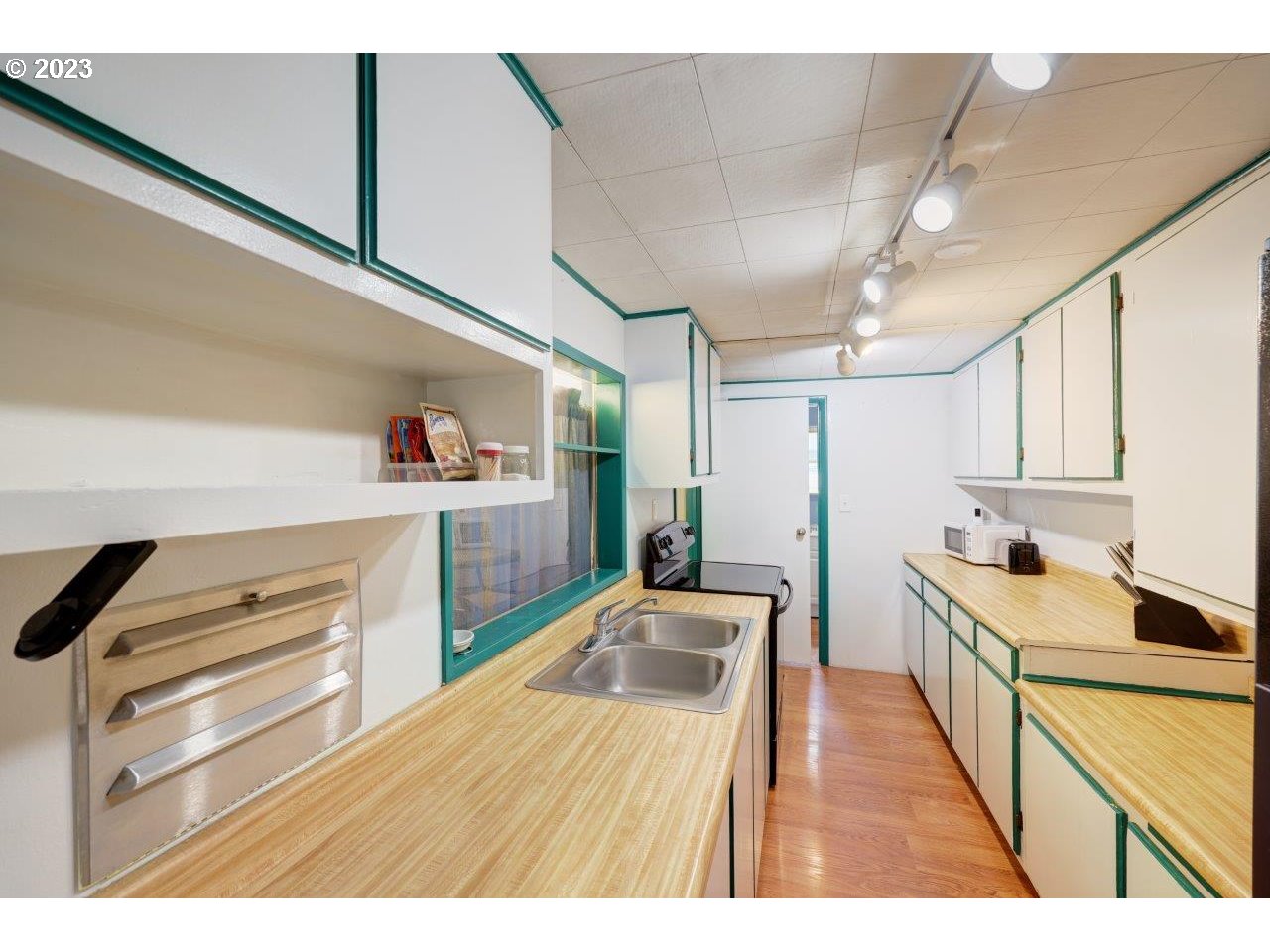 6314 Sandridge Road Long Beach, WA 98631 - Photo 7 of 24 a kitchen view of counter top space and wooden floor