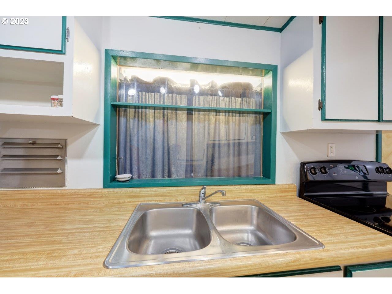 6314 Sandridge Road Long Beach, WA 98631 - Photo 8 of 24 a kitchen with a sink and a large window