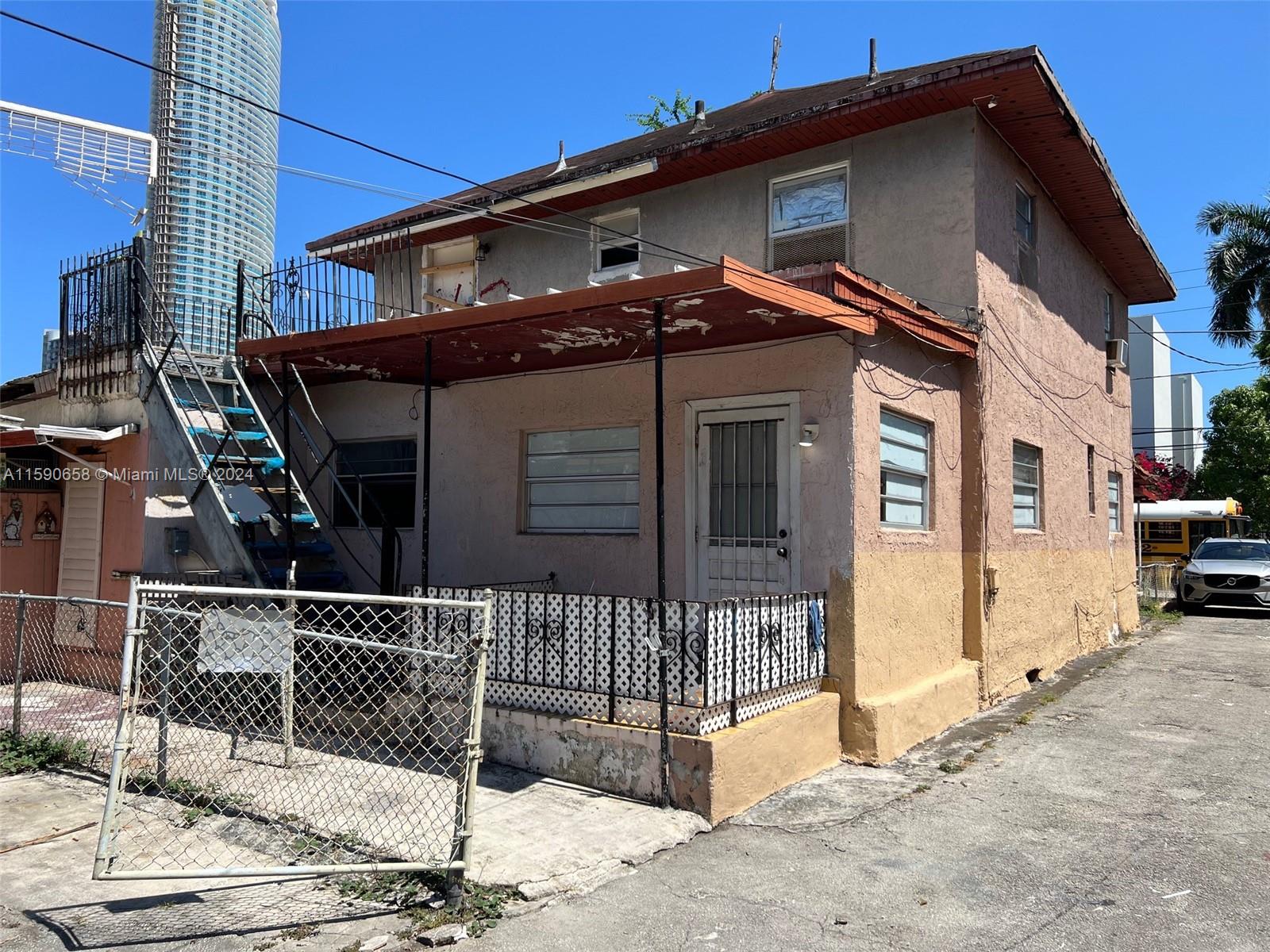 445 Southwest 4th Street Miami, FL 33130 - Photo 2 of 4 a view of a house with wooden fence